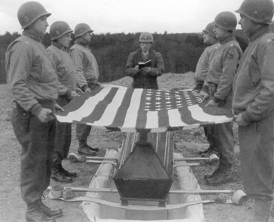 Soldiers hold the American flag
