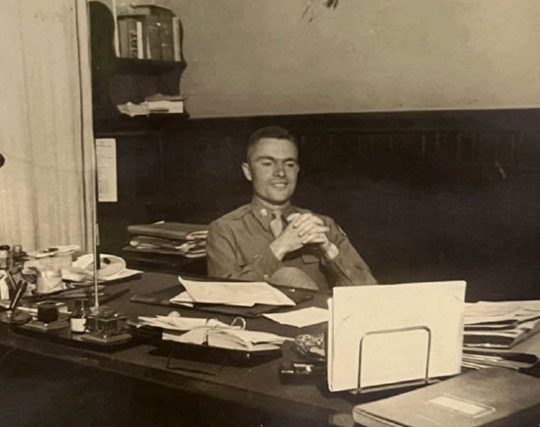 This picture was taken less than a month after Germany surrendered and shows Maj. Verheul in his office completing paperwork.