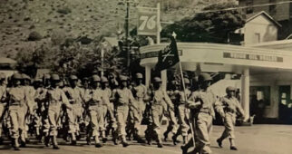 Capt. Verheul is seen leading Company C, 365th Infantry Regiment through a parade somewhere near or at Fort Huachuca, Arizona where the 92nd Division trained.